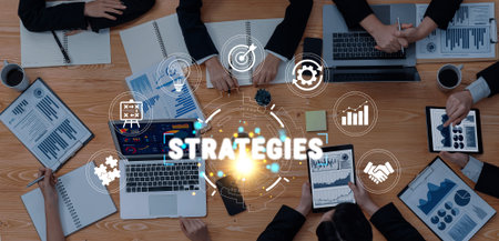 Dynamic Business Meeting with Diverse Professionals Collaborating on Strategies Over a Table Filled...