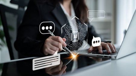 A business professional engages with AI technology on a laptop, showcasing digital communication and...