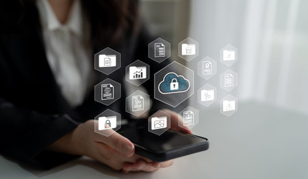 A business professional analyzes a smartphone while surrounded by digital cloud security icons,...