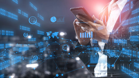 A business professional engages with a smartphone, surrounded by dynamic data visuals, showcasing...