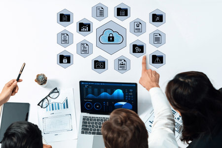 A group of business professionals collaborates in a modern office, analyzing cloud security concepts...