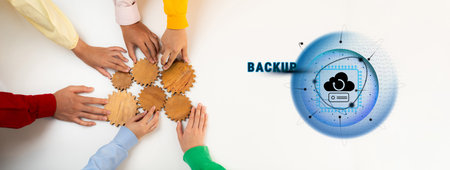 Diverse hands come together in a collaborative effort, arranging gears symbolizing teamwork and...