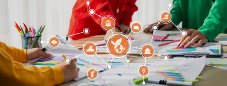 This image captures a vibrant business meeting where individuals collaborate on colorful charts and...