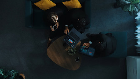 Businessman present marketing plan to smart project manager by using laptop. Business team working together to brainstorm financial strategy while manager hold coffee at meeting room. Directorate.の写真素材