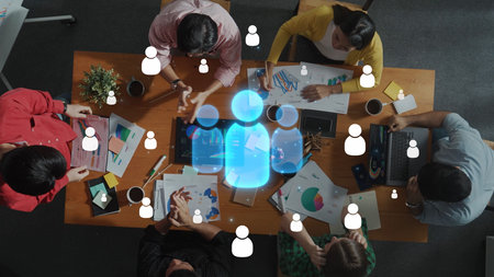 A busy business meeting scene featuring diverse individuals engaged in discussions, analyzing charts...