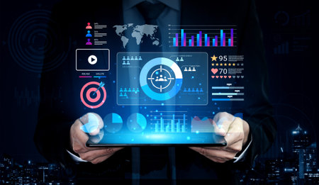 A businessman stands in a dark urban setting, holding a tablet that showcases a modern data...