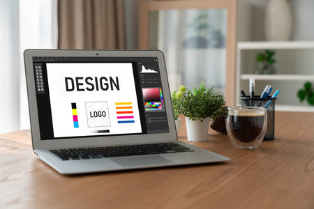 Graphic designer software for modern design of web page and commercial ads showing on the computer...