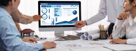 Group of interior architect designer discussing together on blueprint and laptop screen display...