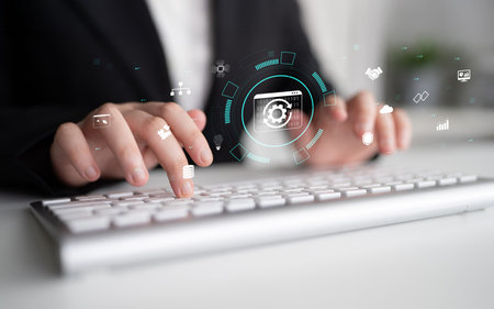 Business Professional Using Computer Keyboard with Digital Graphics and Technology Interface for...