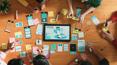 Programmer sharing Ux Ui design for mobile phone interface idea with software developer while...