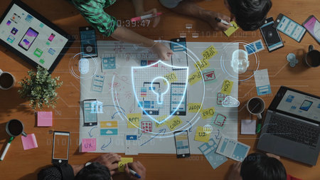 A dynamic team collaborates on cybersecurity strategies using digital devices and sticky notes on a...