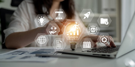 A focused businesswoman engages with a laptop, surrounded by dynamic productivity icons and digital...