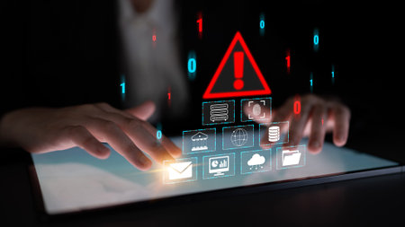 Hands on Tablet with Digital Warning Sign and Symbols Representing Cybersecurity Risk and Data...