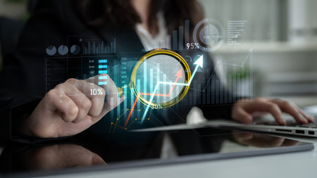 A businesswoman engages with a virtual analytics dashboard featuring statistics and graphs,...