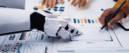 A futuristic robot arm assists professionals in analyzing data with various graphs and charts on a...