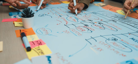 A vibrant team engages in a strategic planning session, using colorful sticky notes and markers to...