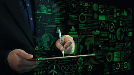 A businessman demonstrates interaction with a high-tech digital dashboard showcasing green energy...