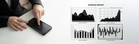 A business professional interacts with a smartphone while analyzing various statistical charts and...