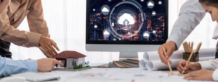 Group of interior architect designer discussing together on blueprint and laptop screen display...