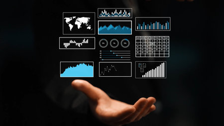 Business Analytics and Data Visualization Concepts with Charts and Graphs Showcased by a Hand in a...