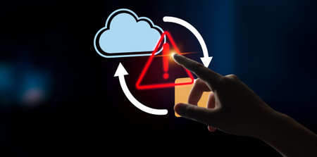 A hand reaching to an error alert symbol on a digital screen, representing the critical nature of...