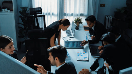 Top view of smart executive manager financial graph to diverse team while group of multicultural...