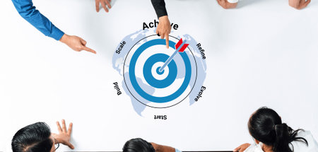 A diverse group of professionals engage in a collaborative strategy session focused on achieving...