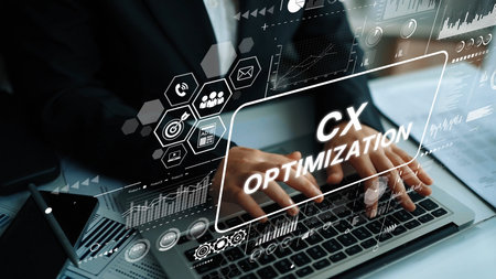 Digital Interface for Customer Experience Optimization with Data Charts and Hands on Laptop...