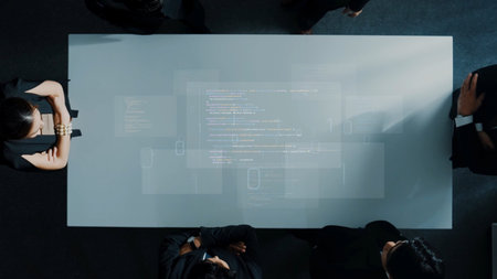 A dynamic business meeting showcasing professionals collaborating around a modern table with digital...