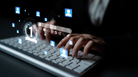 Business professional typing on computer keyboard with virtual icons representing digital marketing,...