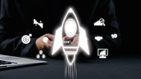 Visual representation of business growth and innovation featuring a rocket icon, technology...