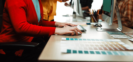 A vibrant design session in a modern workspace highlights creative professionals collaborating over...
