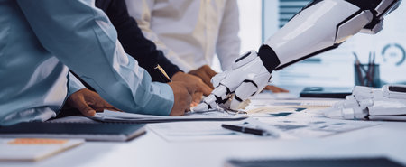 An engaging scene of collaboration in a modern office where human hands and a robot arm work...