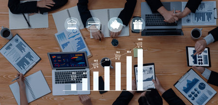 Collaborative Business Meeting with Charts, Graphs, Laptops, and Tablets Showcasing Growth and...