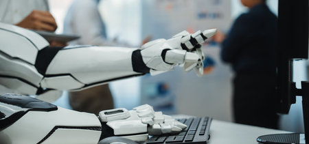 Robotic Arm Interacting with Computer Keyboard in Modern Office Environment with Professionals...