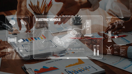 A group of professionals collaborate in a meeting focused on electric vehicle technology, analyzing...