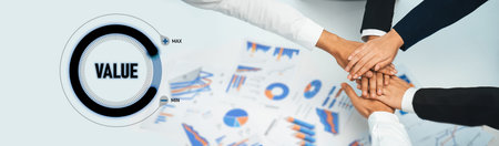 A dynamic scene featuring diverse hands joining together over financial charts and graphs,...