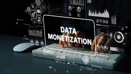 Modern Data Monetization Concept with Hands on Keyboard and Graphical Analytics Background Display....