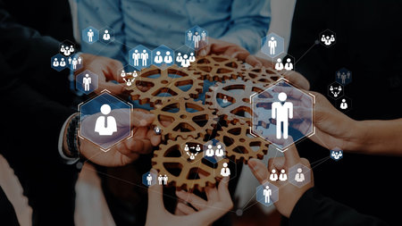 Collaborative teamwork with wooden gears and digital icons showing people and connections,...