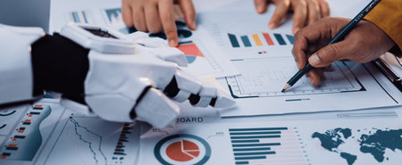A futuristic collaboration scene features human and robotic hands analyzing various data...