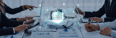A dynamic business team works together in a modern office, focusing on security solutions using...