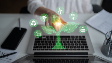 Digital Transformation in Sustainable Development with Green Technology Icons and a Virtual Tree on a Laptop Showing Innovation and Eco-Friendly Solutions.の写真素材