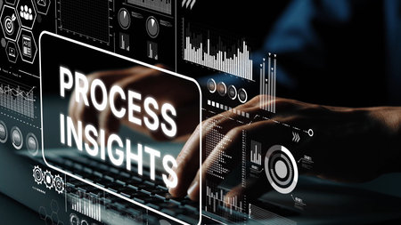 Hands Typing on Keyboard with Digital Graphics Representing Process Insights and Data Analysis in...