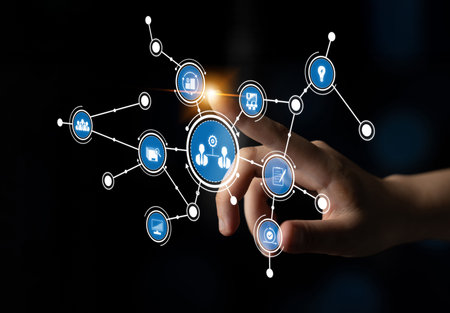 A hand reaches out toward a digital network, featuring icons that represent concepts of technology,...