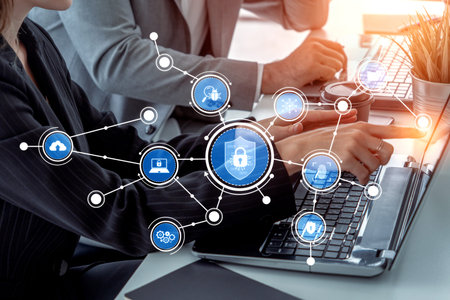 Business professionals engage in a discussion on cybersecurity strategies, highlighted by a digital...