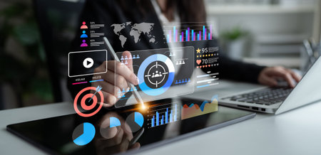 A business professional engages with a digital tablet showcasing financial charts and graphs,...