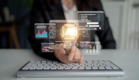 Business professional analyzing data with innovative technology displaying dynamic graphics and...