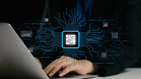 Close-up view of hands typing on a sleek laptop, surrounded by vivid digital graphics representing...