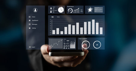 A high-tech business analytics dashboard is shown on a smartphone, featuring graphs and charts that...