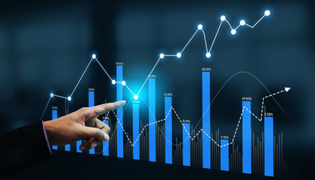 A businessman points at a dynamic data graph representing market trends and financial metrics,...